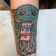 Image for article titled Gone too far, this tattoo of Baby Yoda drinking a White Claw has